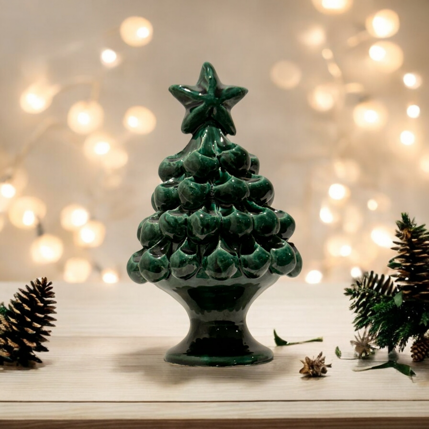 Ceramic Christmas tree shaped decoration with holiday lights in the background